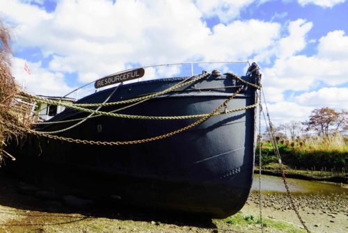 A rather splendid boat, caught at low tide on the Thames ...